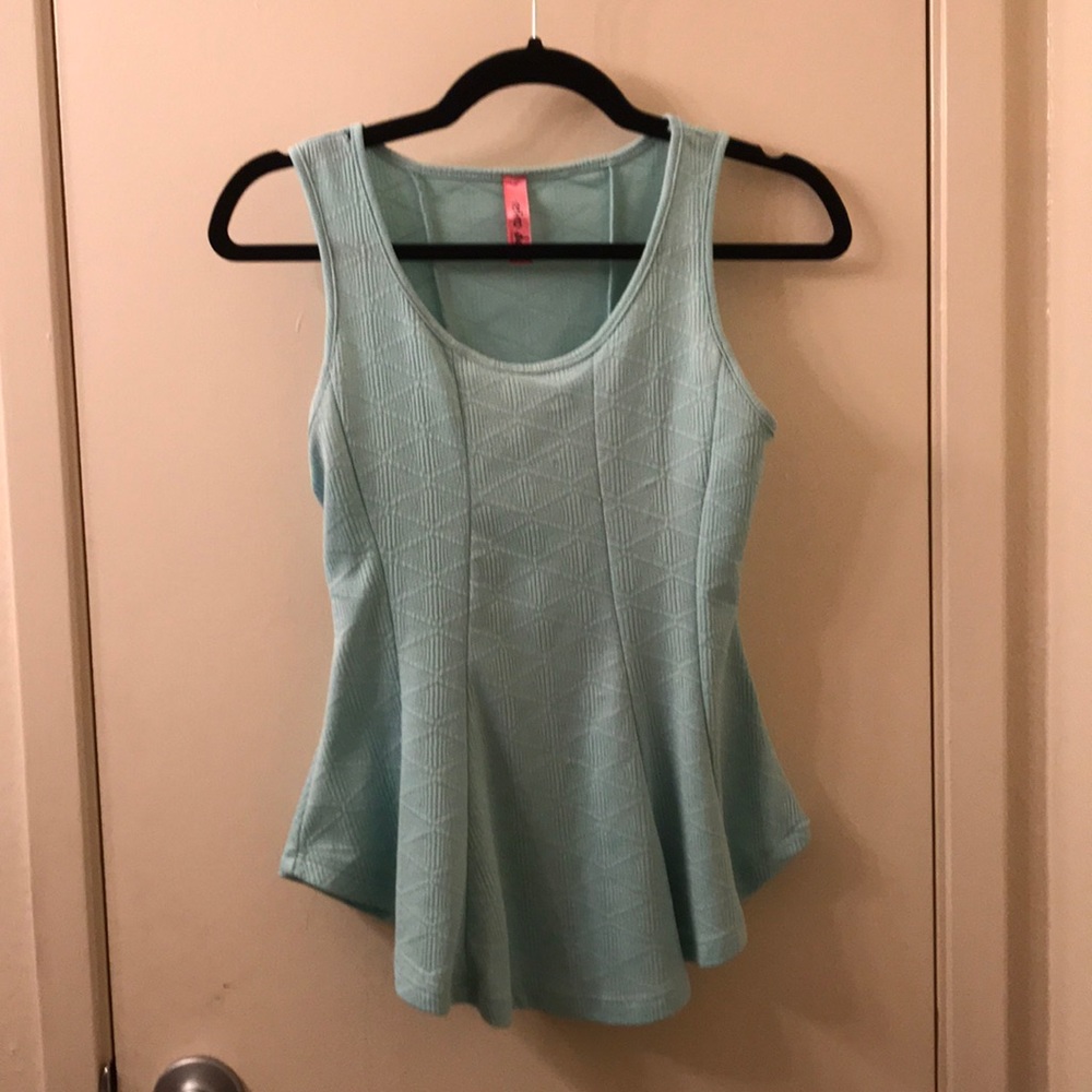 Geometric patterned peplum top